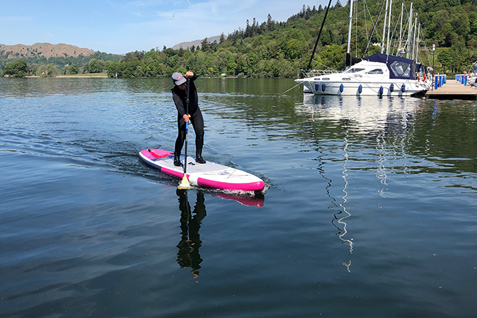 2 bare feet paddle boards