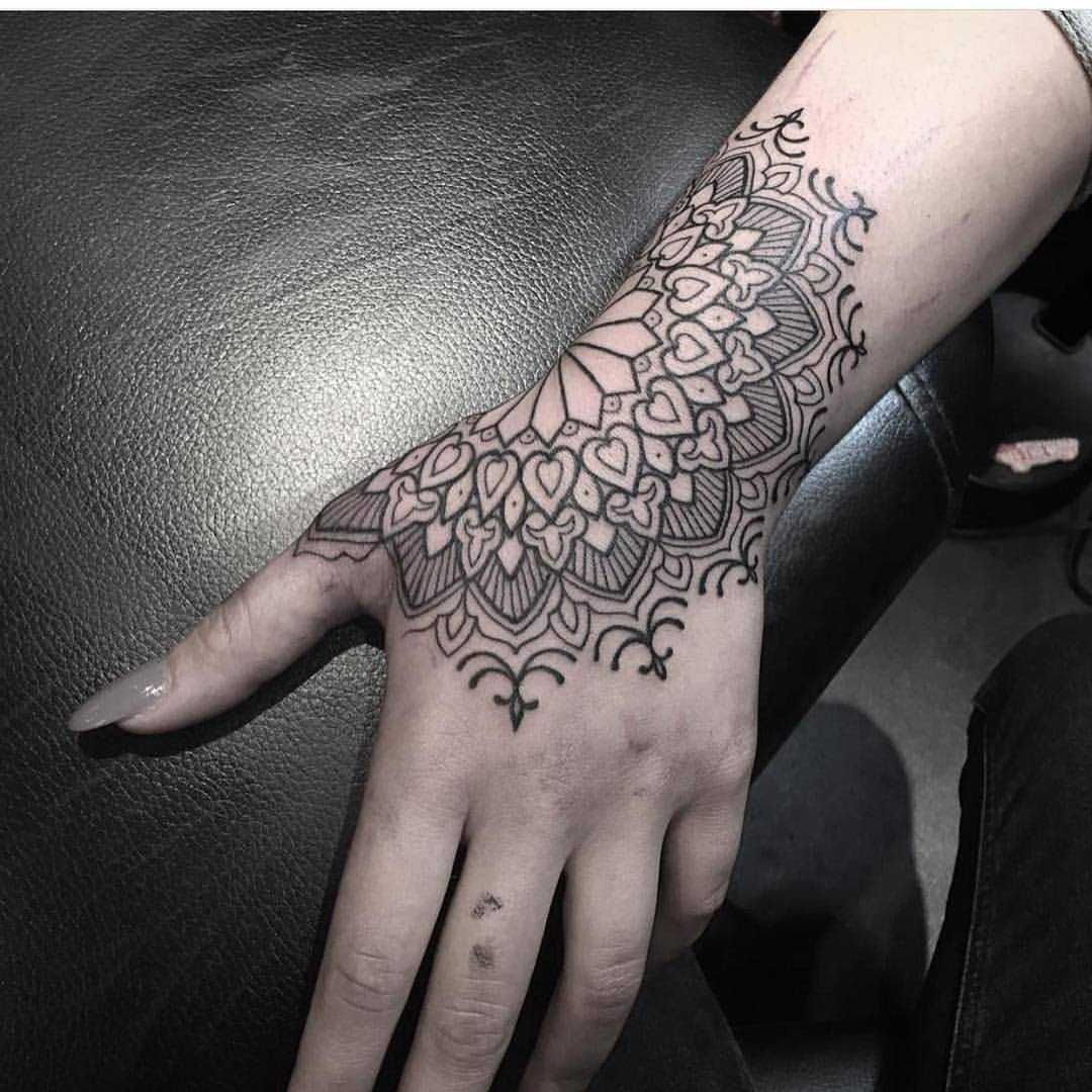 mandala tattoo hand