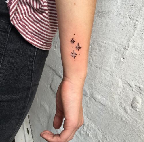 minimalist sparkle tattoo