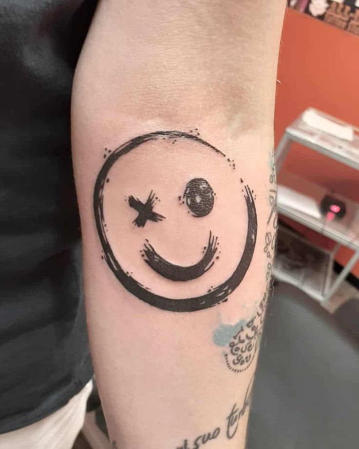 smiling face tattoo