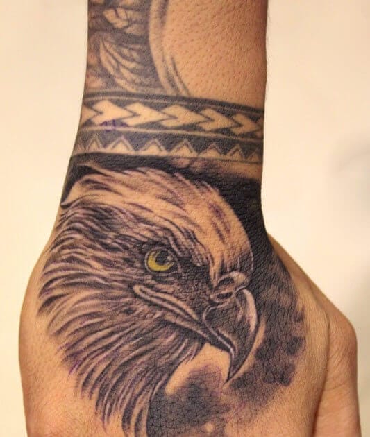 eagle tattoo on hand boy