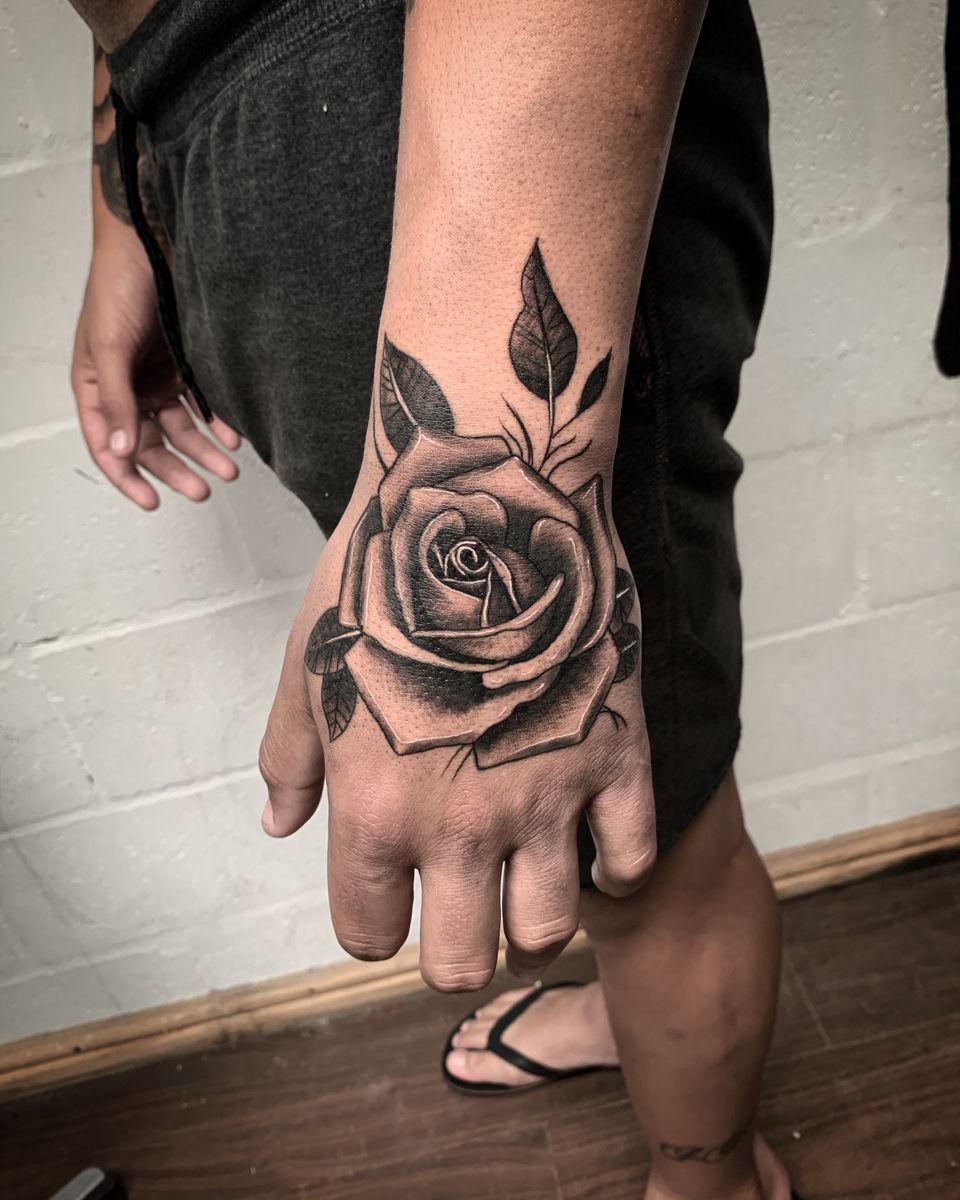 rose hand tattoo men