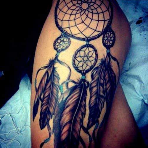 dream catcher tattoo on thigh