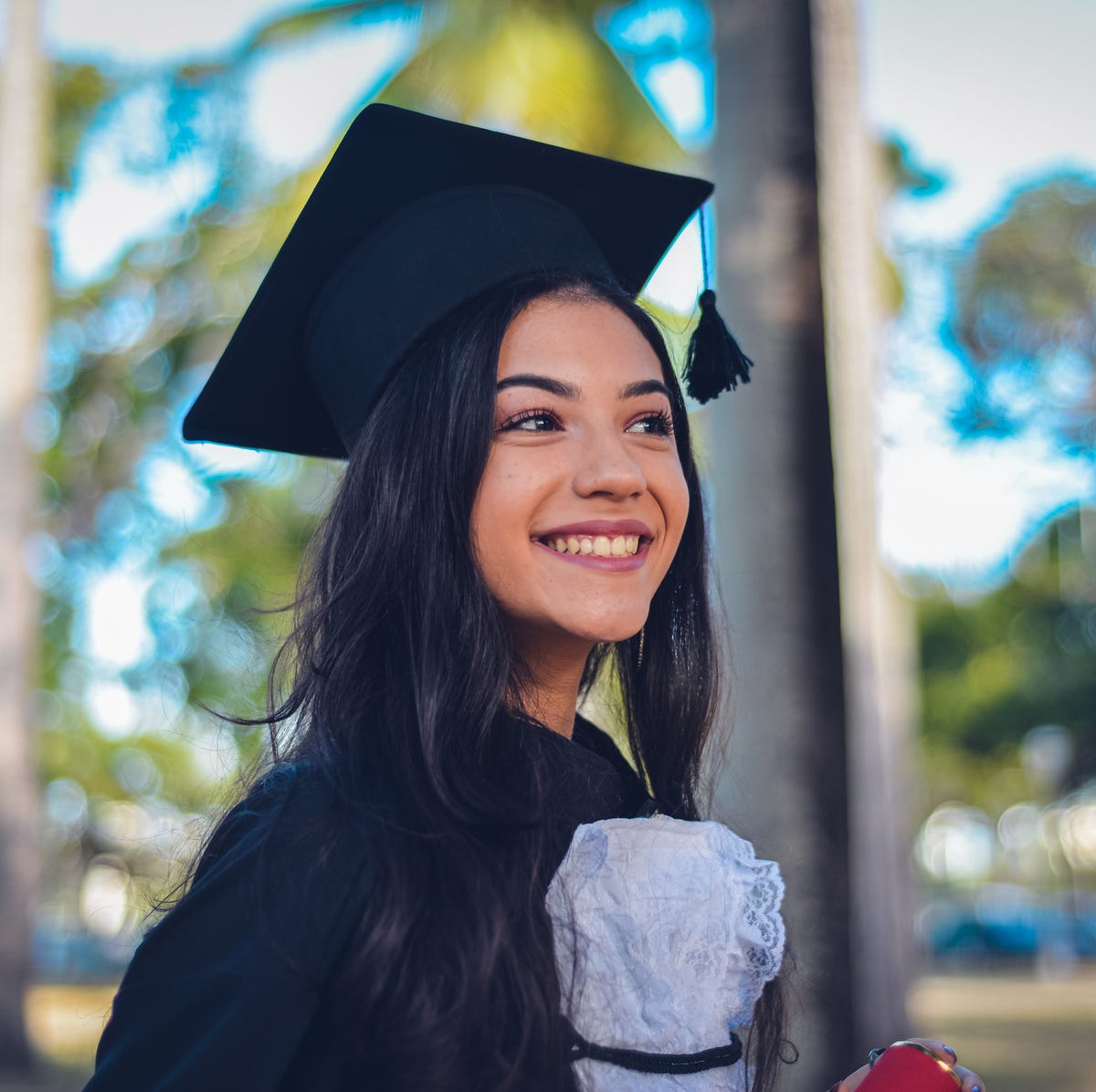 poses for graduation photos