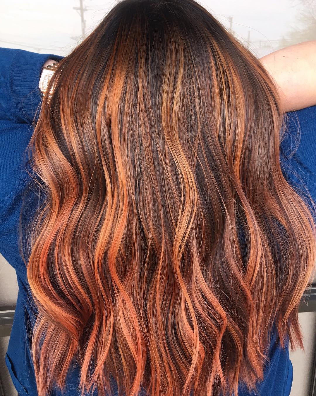 dark red brown hair with caramel highlights