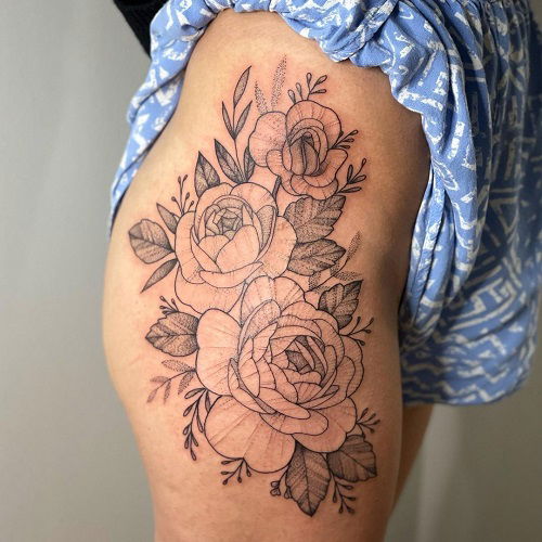 tattoo of roses on thigh