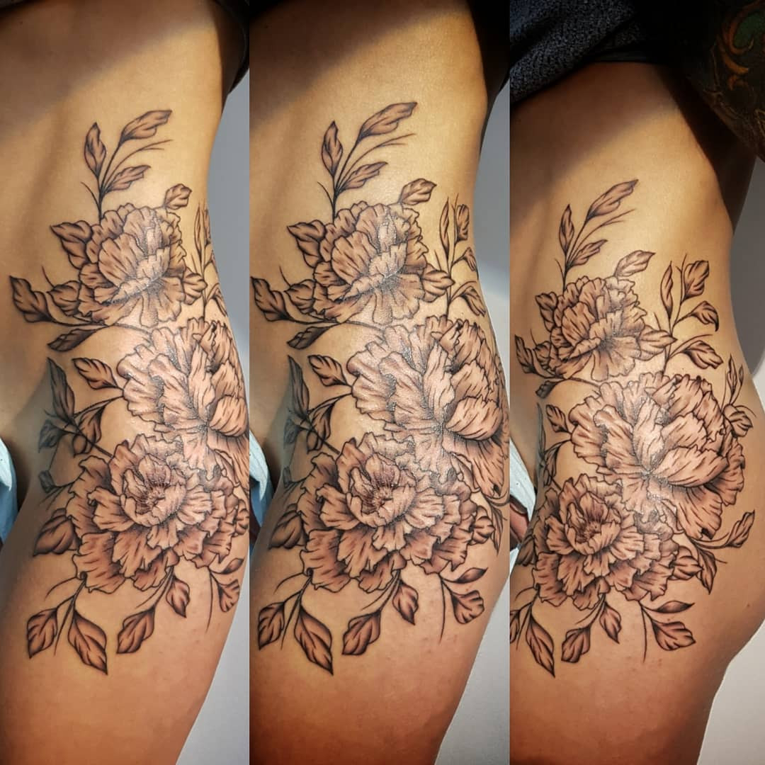 floral tattoo on thigh