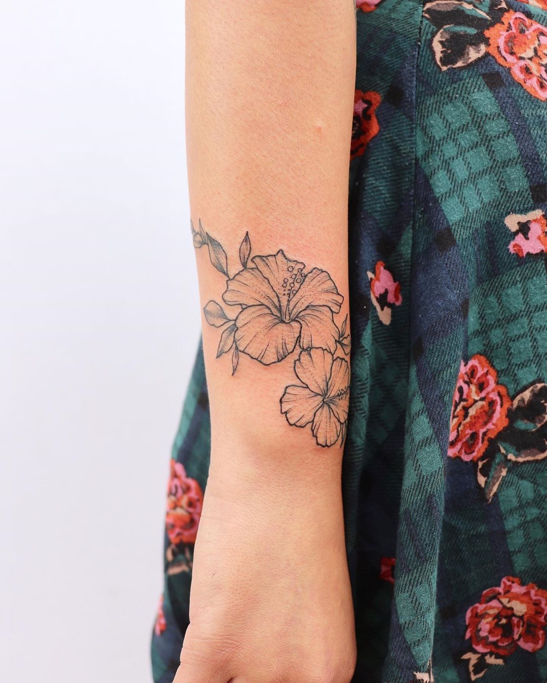 hibiscus wrist tattoo