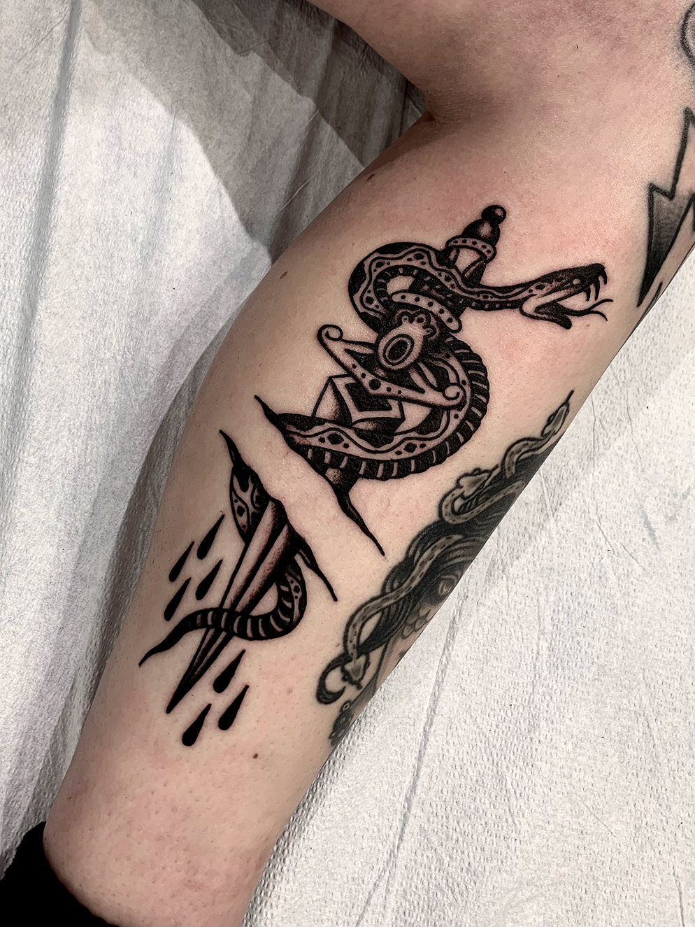 snake with dagger tattoo meaning